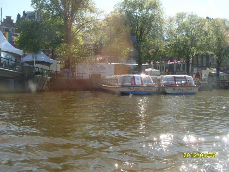 s1050185canalboatsatriveramsteldowntownamsterdam.jpg